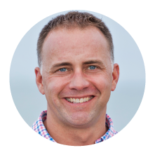 A headshot photo of Patrick Serfass, an executive director for American Biogas Council testifying about Regenis' knowledge about biogas.